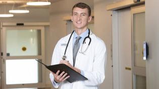 Medical doctor reviewing a patient chart.