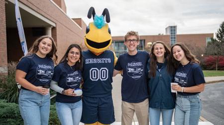 Students standing with Stinger